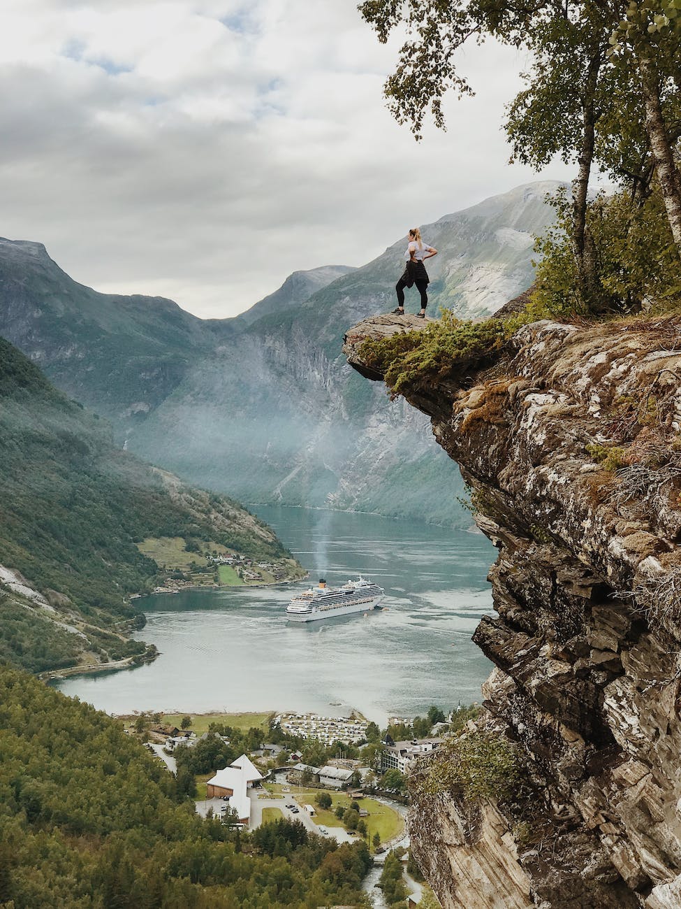 woman standing on the cliff